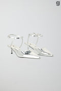 Pointed silver pumps