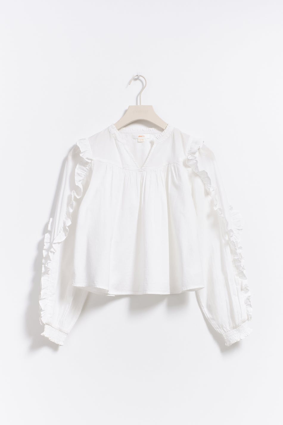 Y buttoned frill blouse