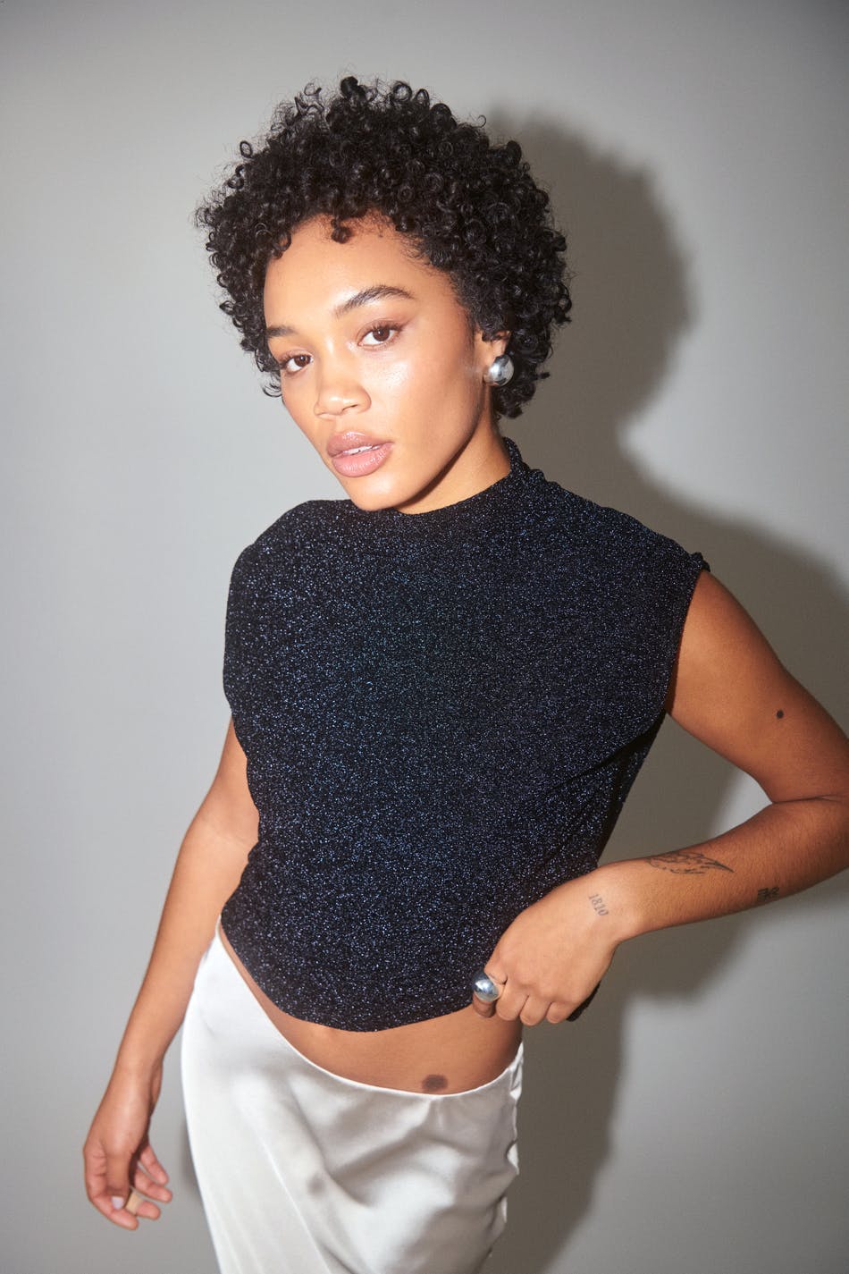 Loose glitter funnel neck top