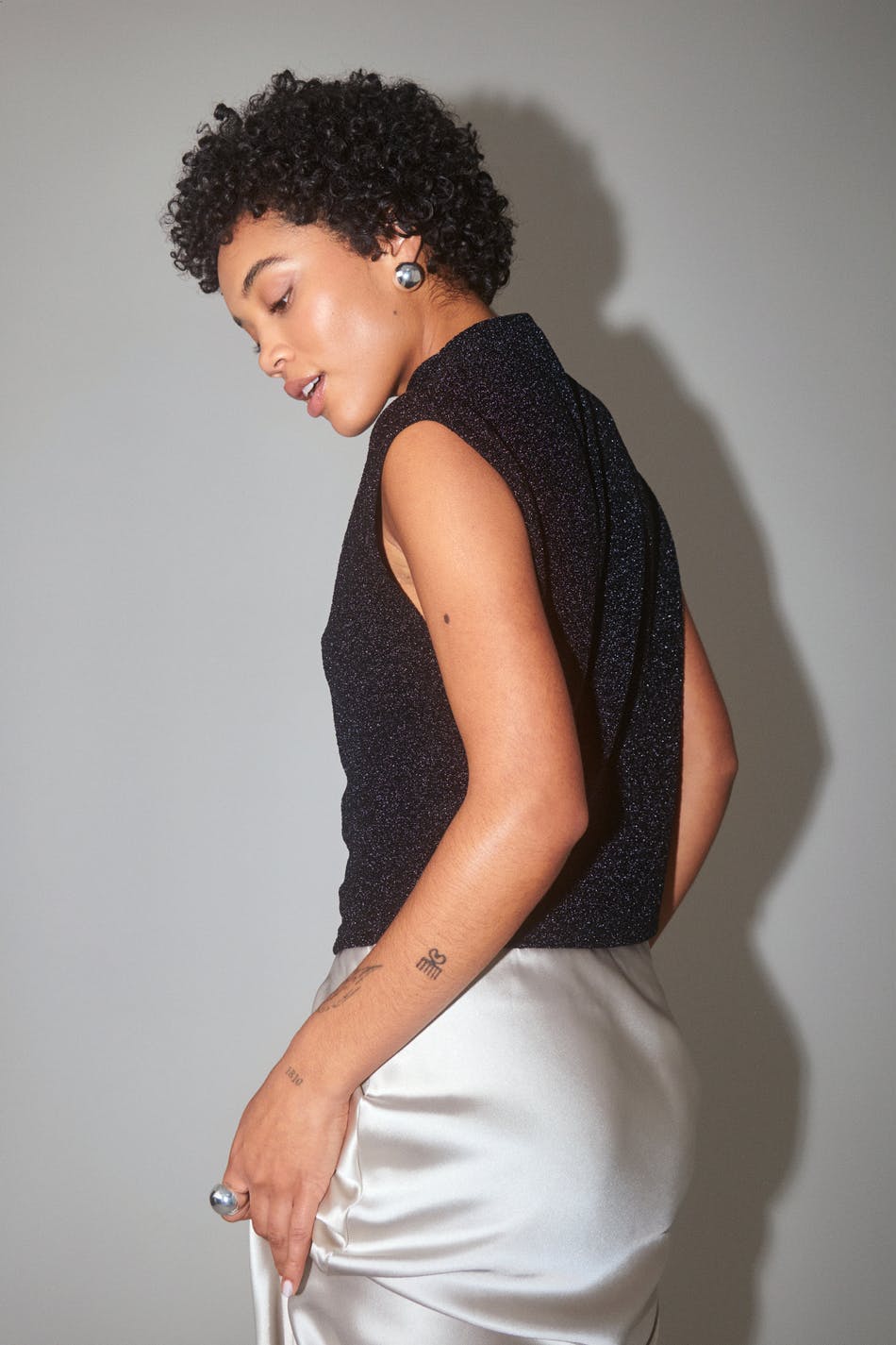 Loose glitter funnel neck top