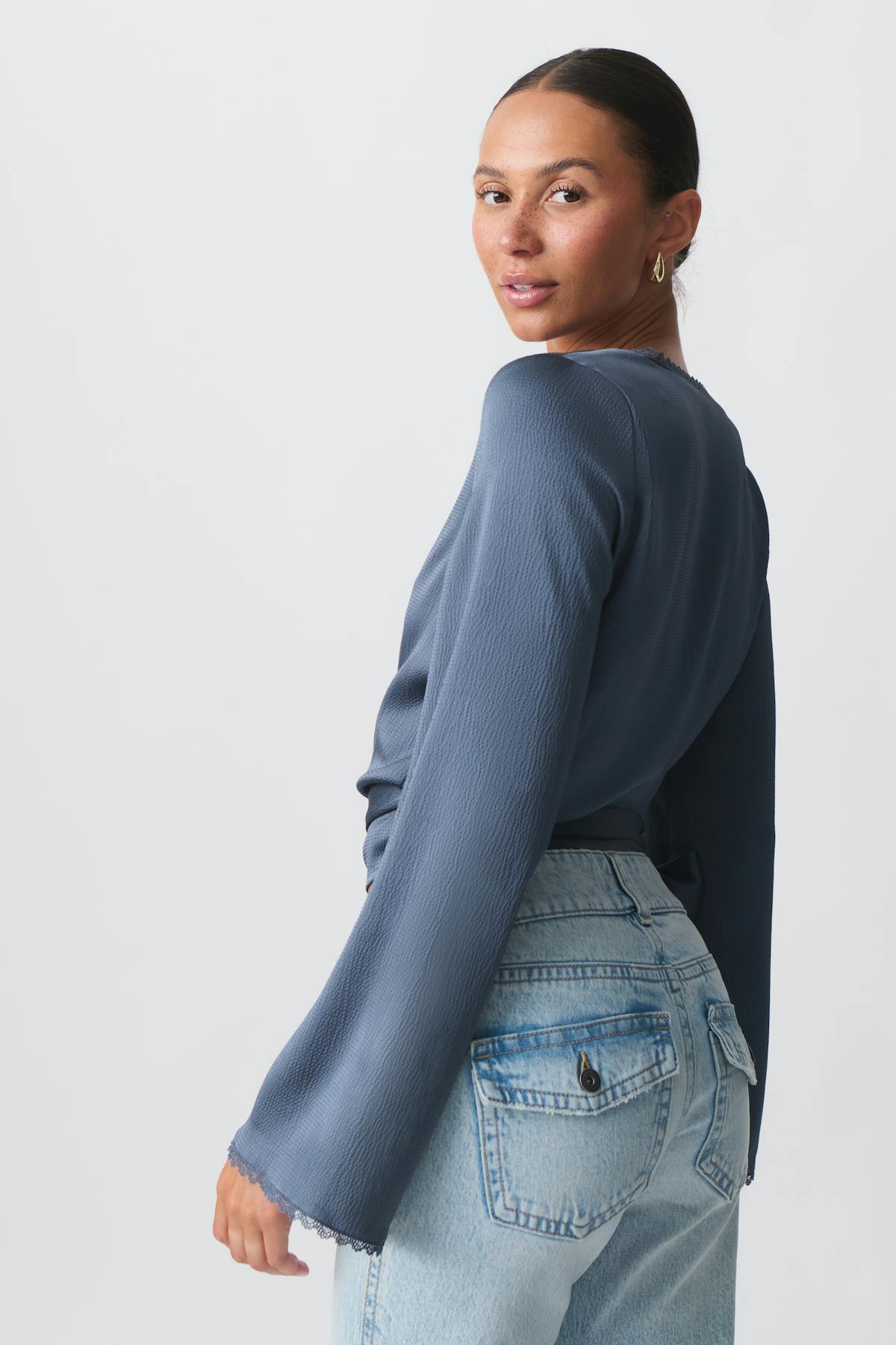 Scalloped edge wrap blouse
