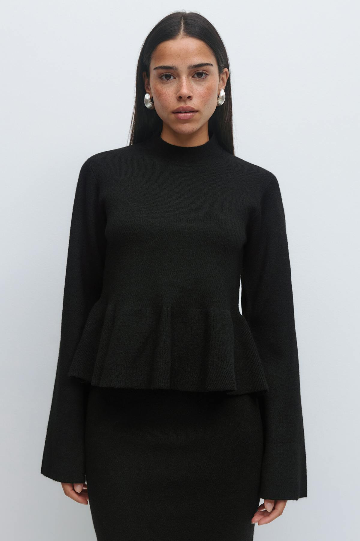 Knitted peplum top
