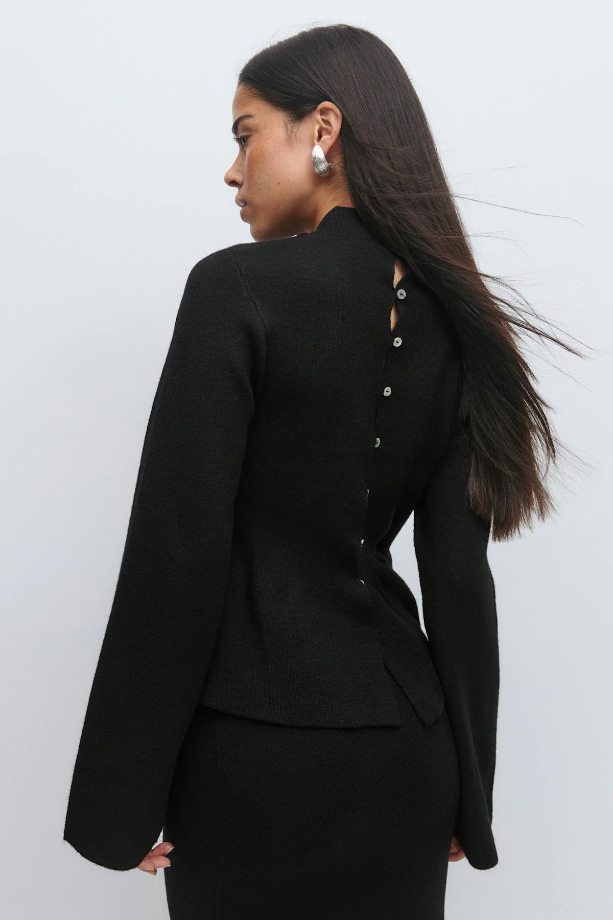 Knitted peplum top