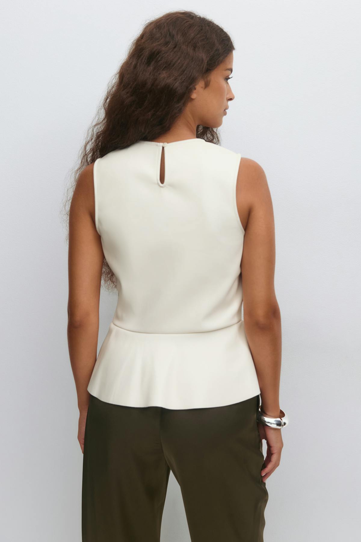 Pu peplum top