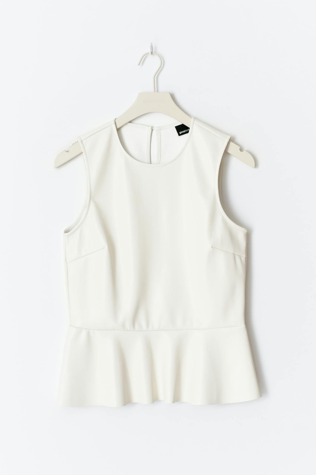 Pu peplum top