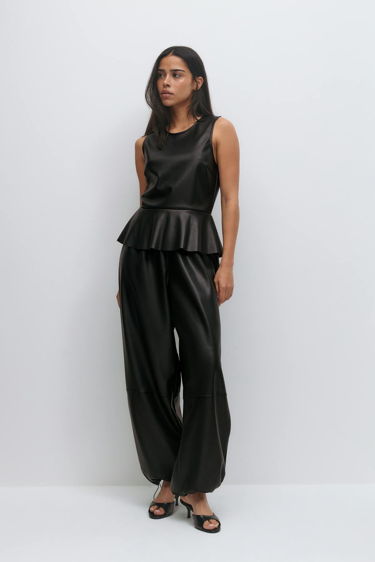 Pu peplum top