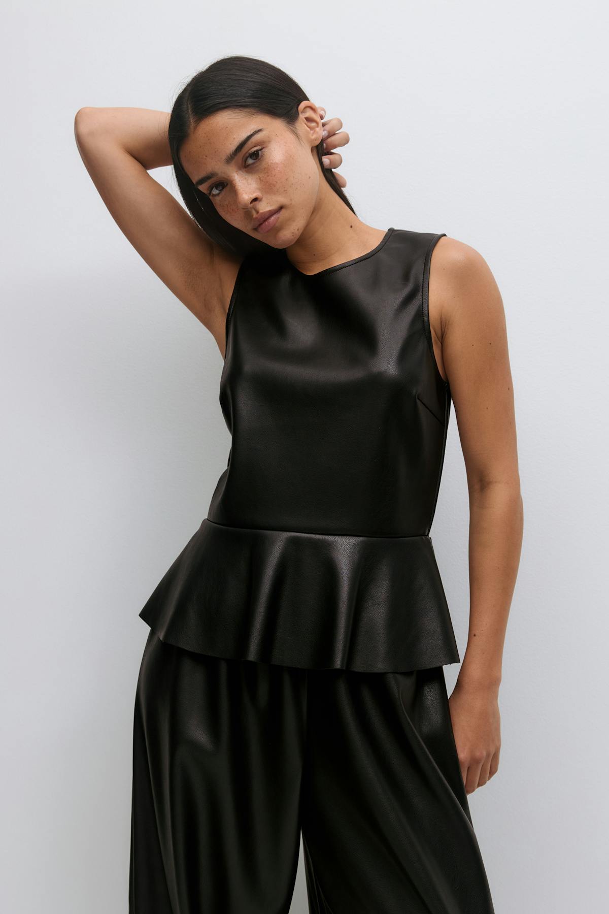 Pu peplum top