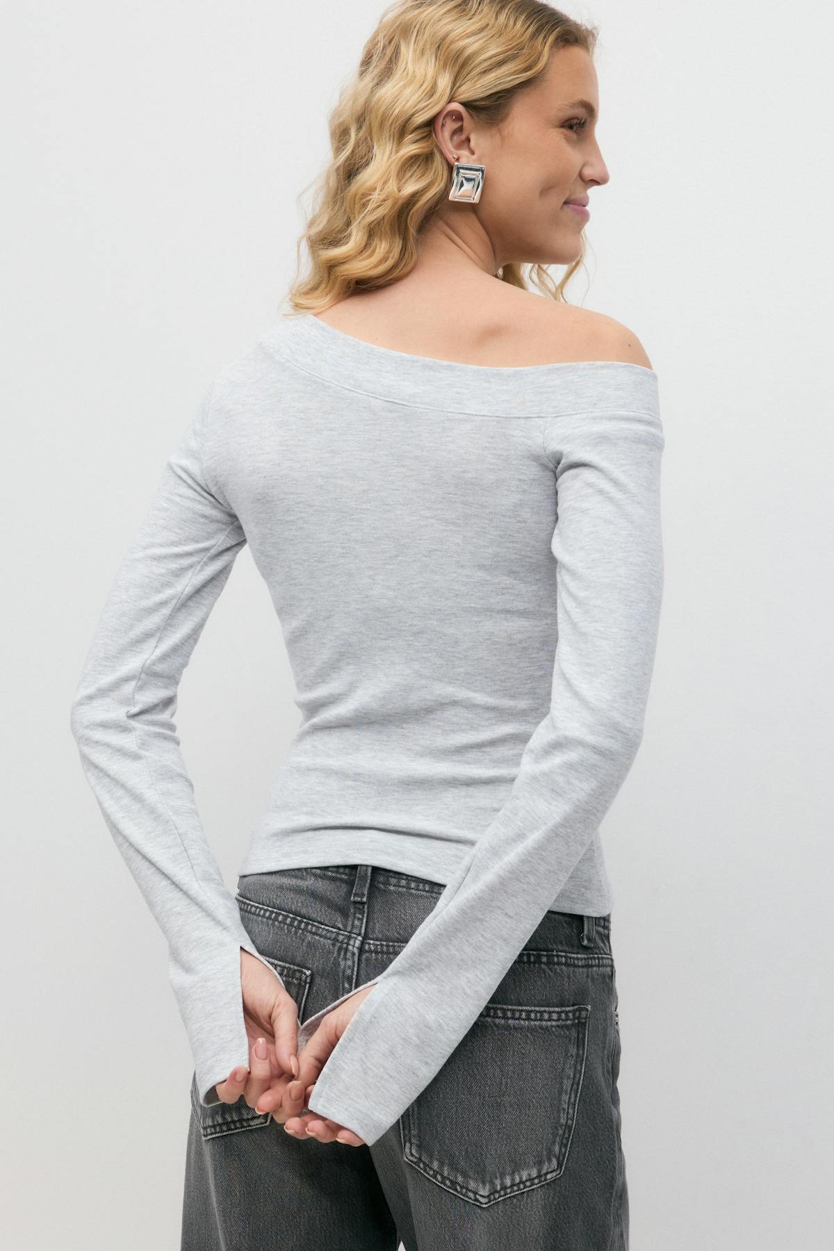 Sloped shoulder top