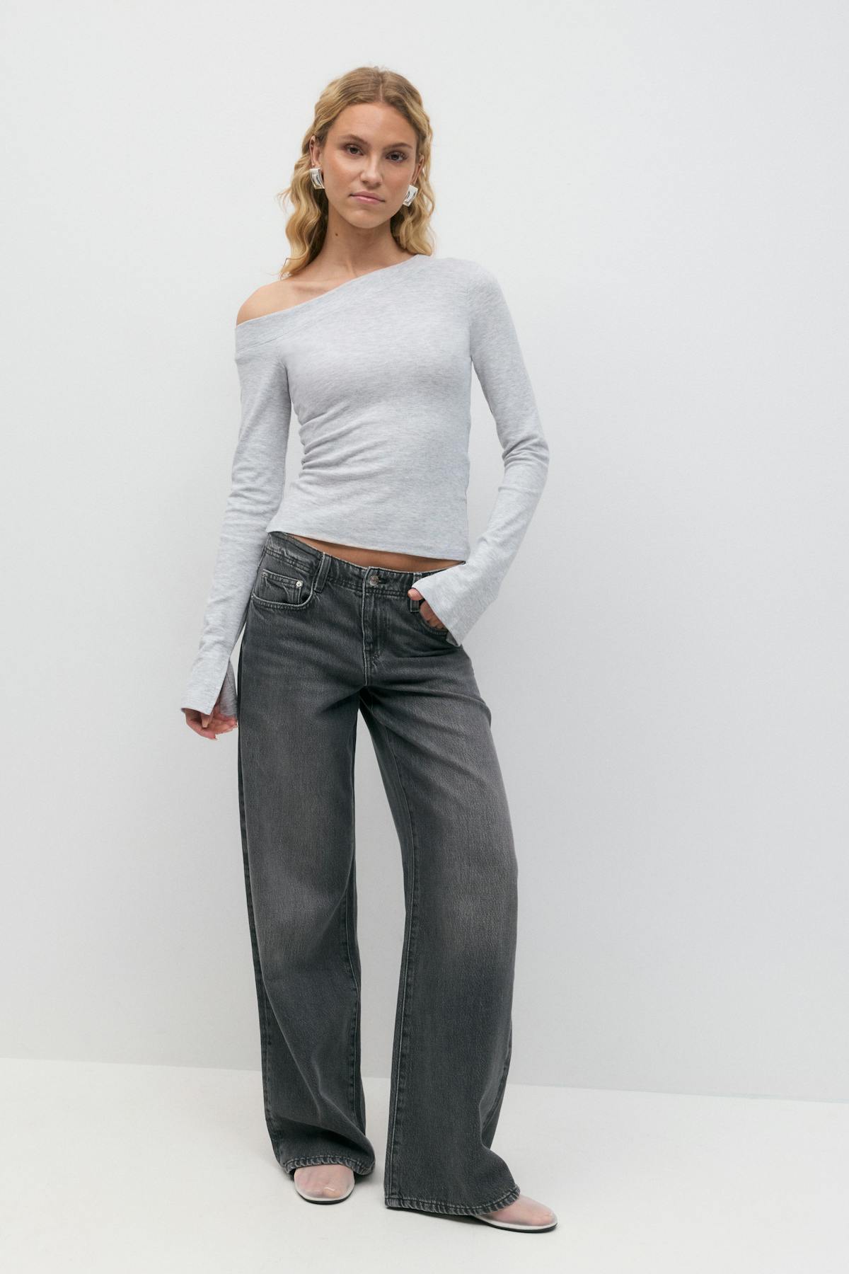 Sloped shoulder top