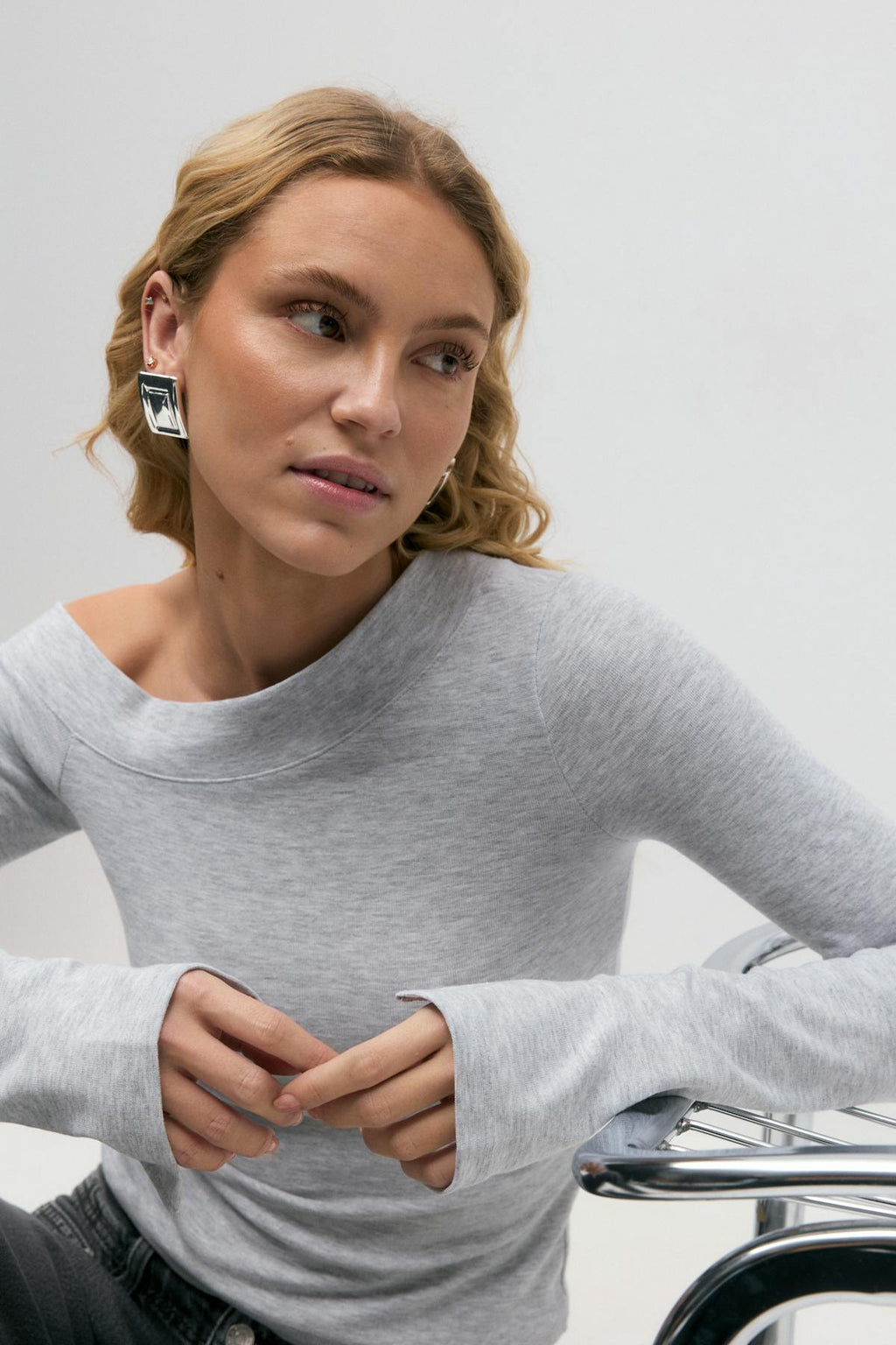Sloped shoulder top