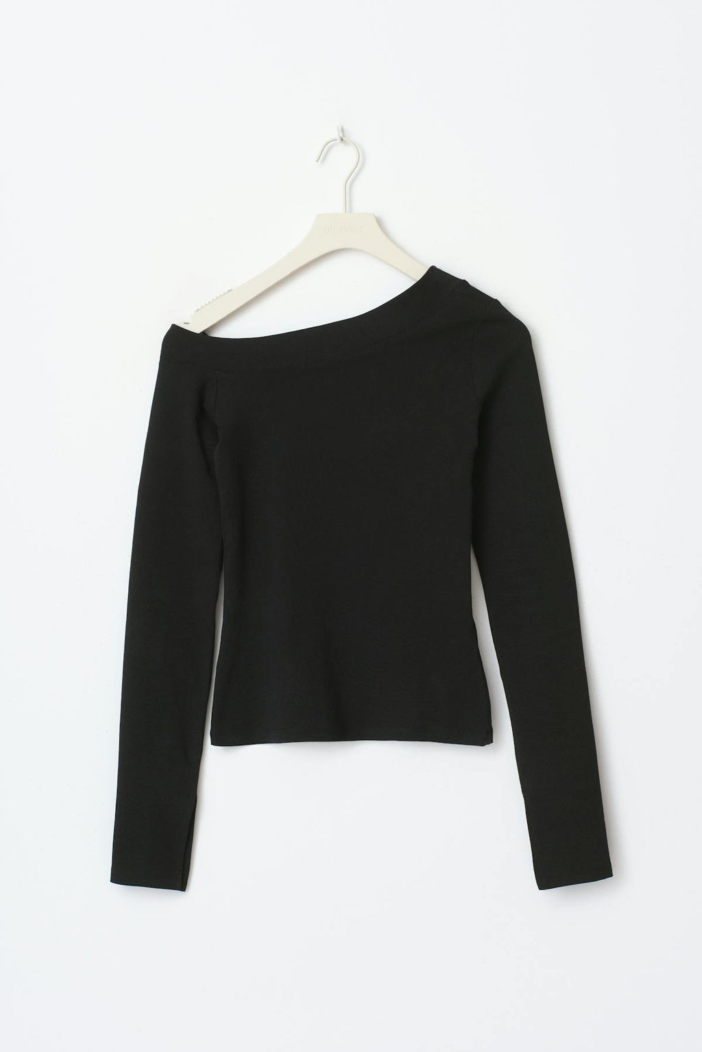 Sloped shoulder top