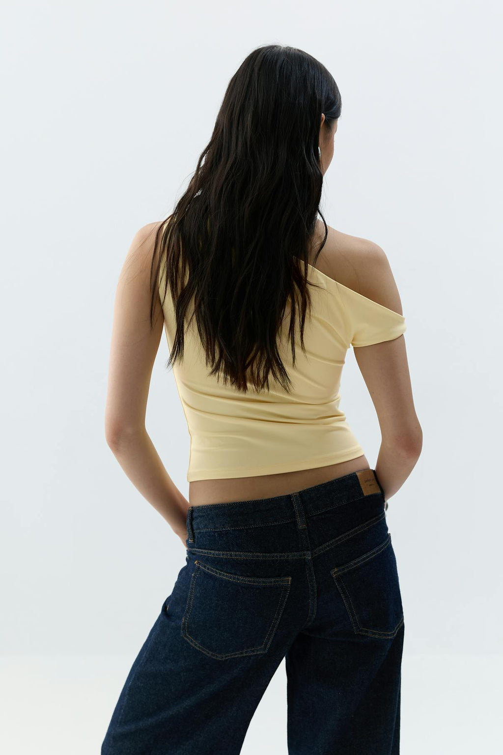 Asymmetric micro top