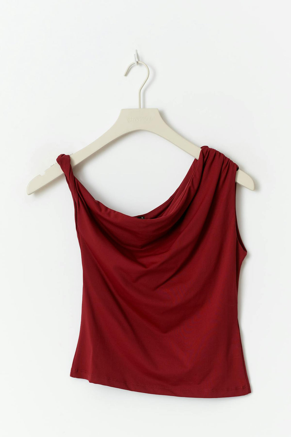 Asymmetric micro top