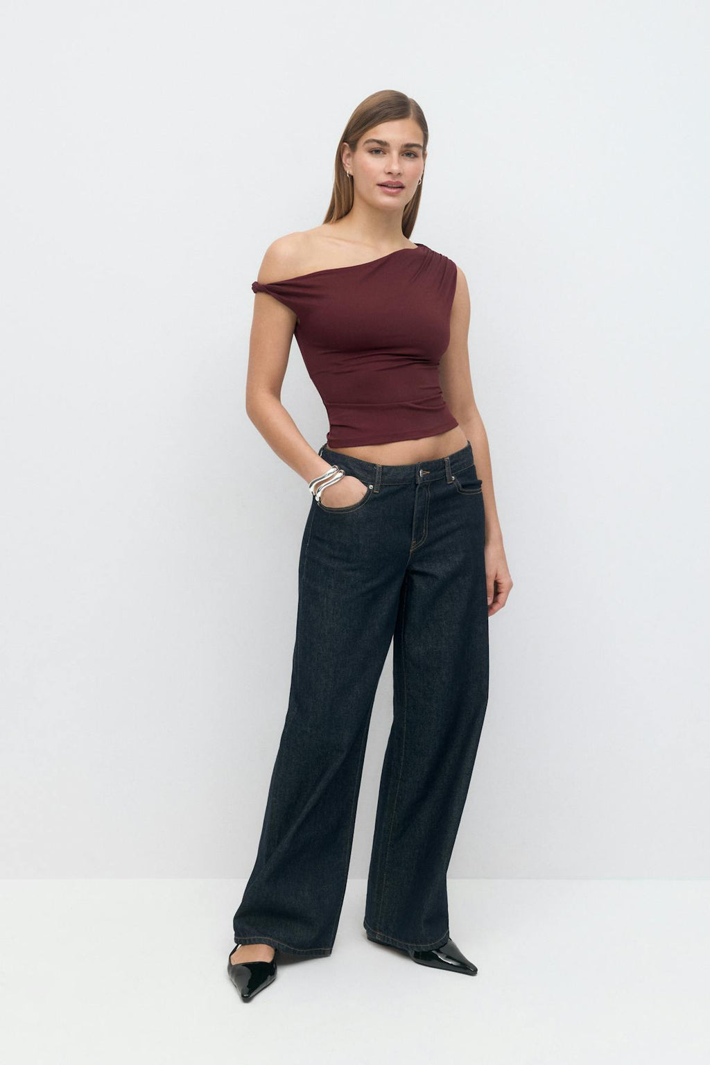 Asymmetric micro top