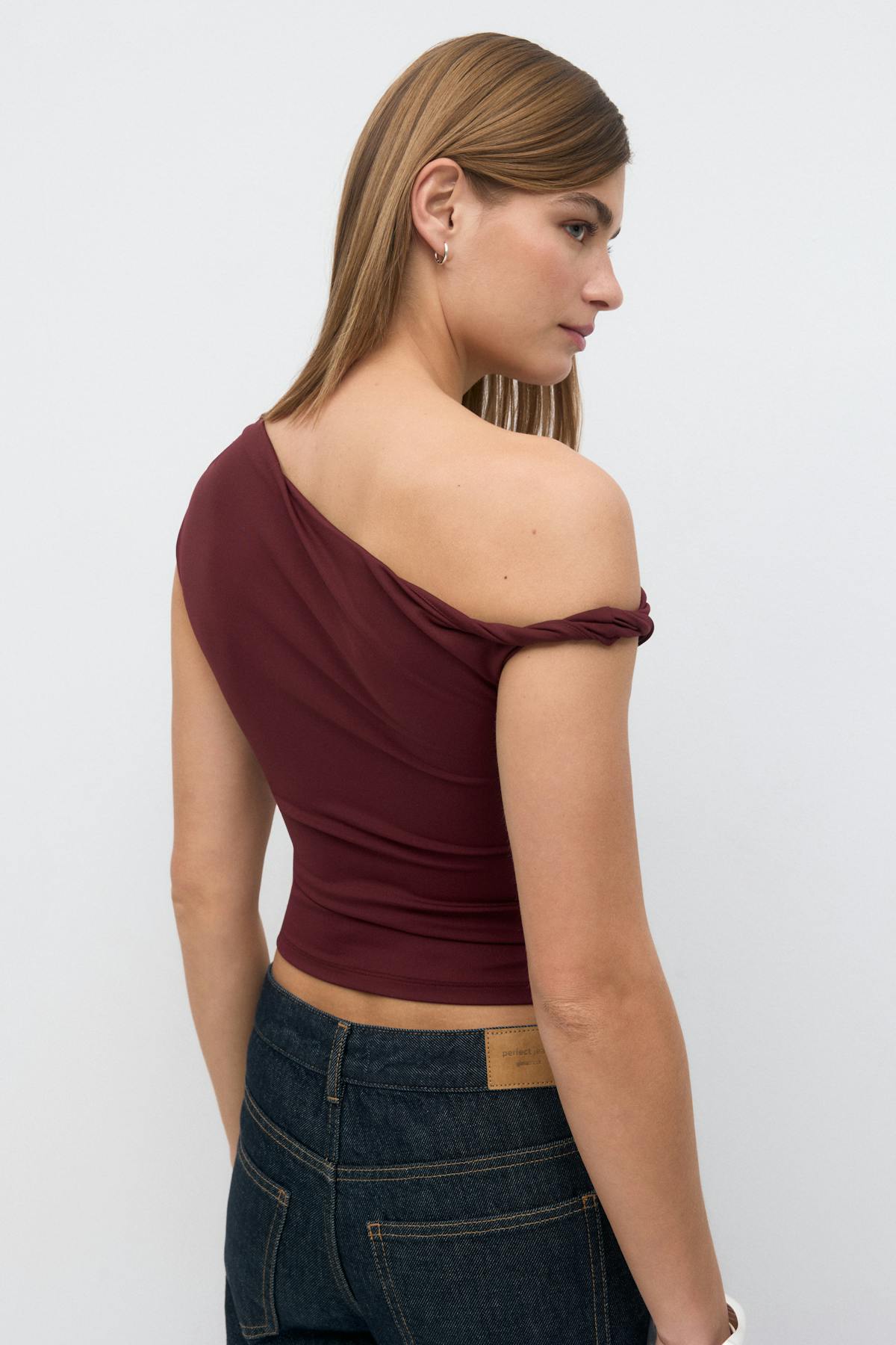 Asymmetric micro top