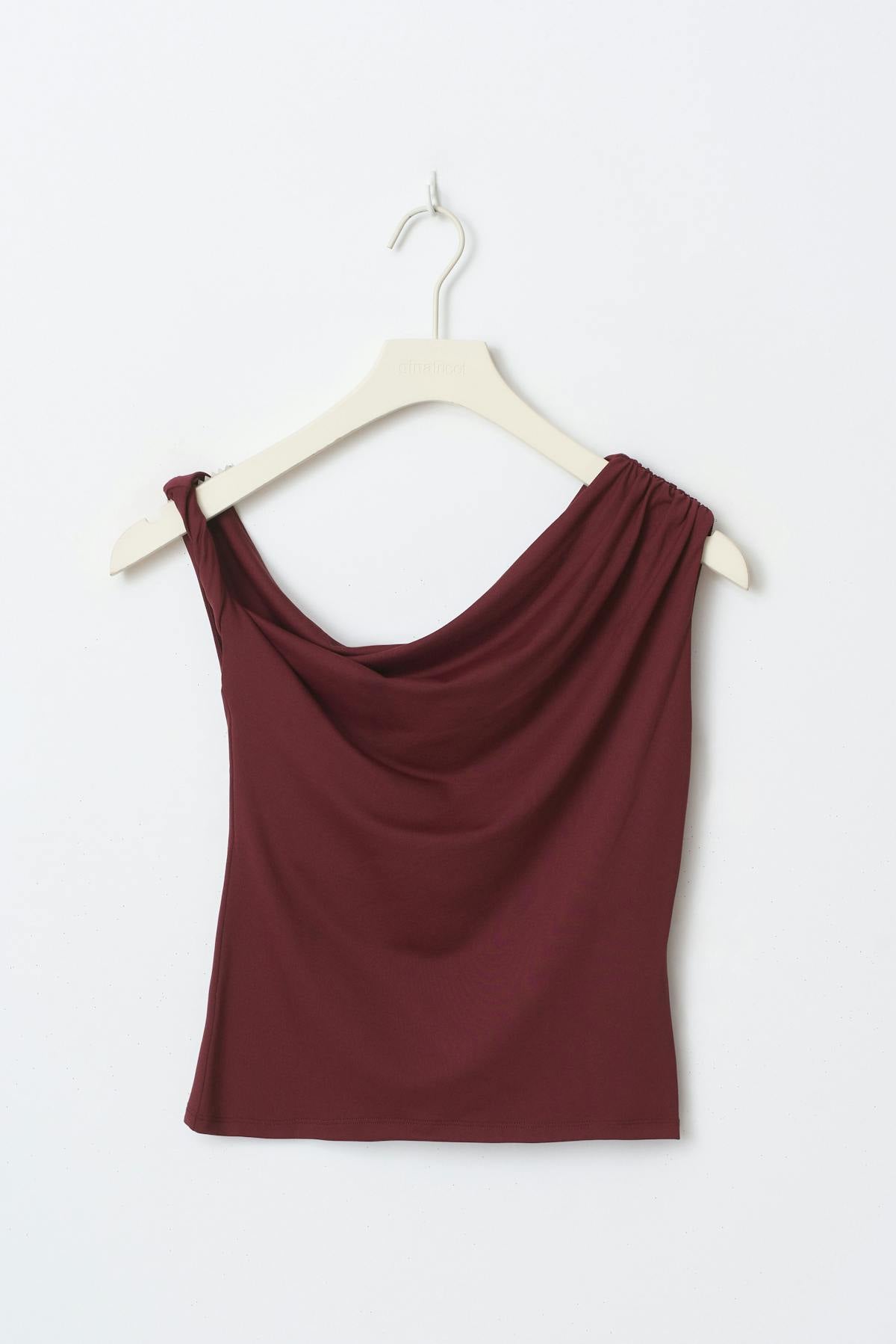 Asymmetric micro top