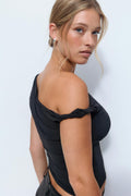 Asymmetric micro top