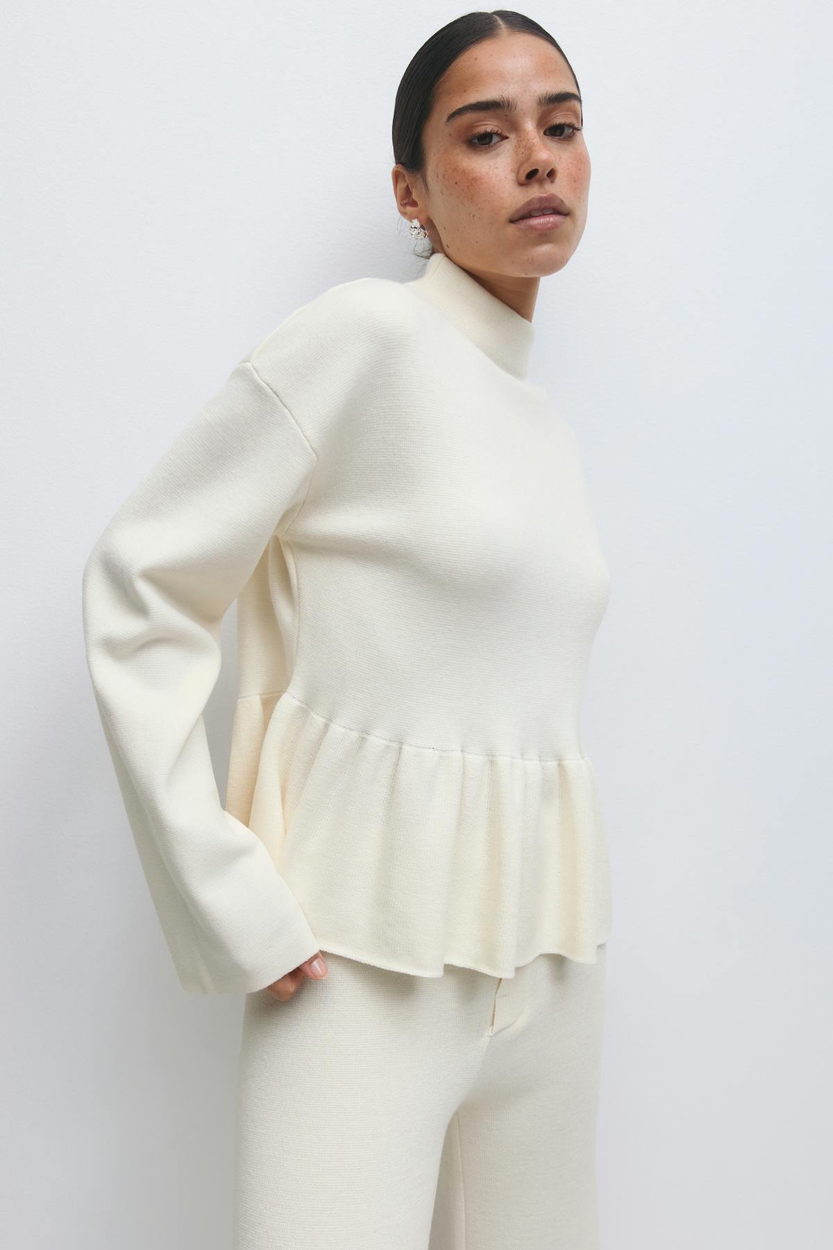 Knitted peplum top