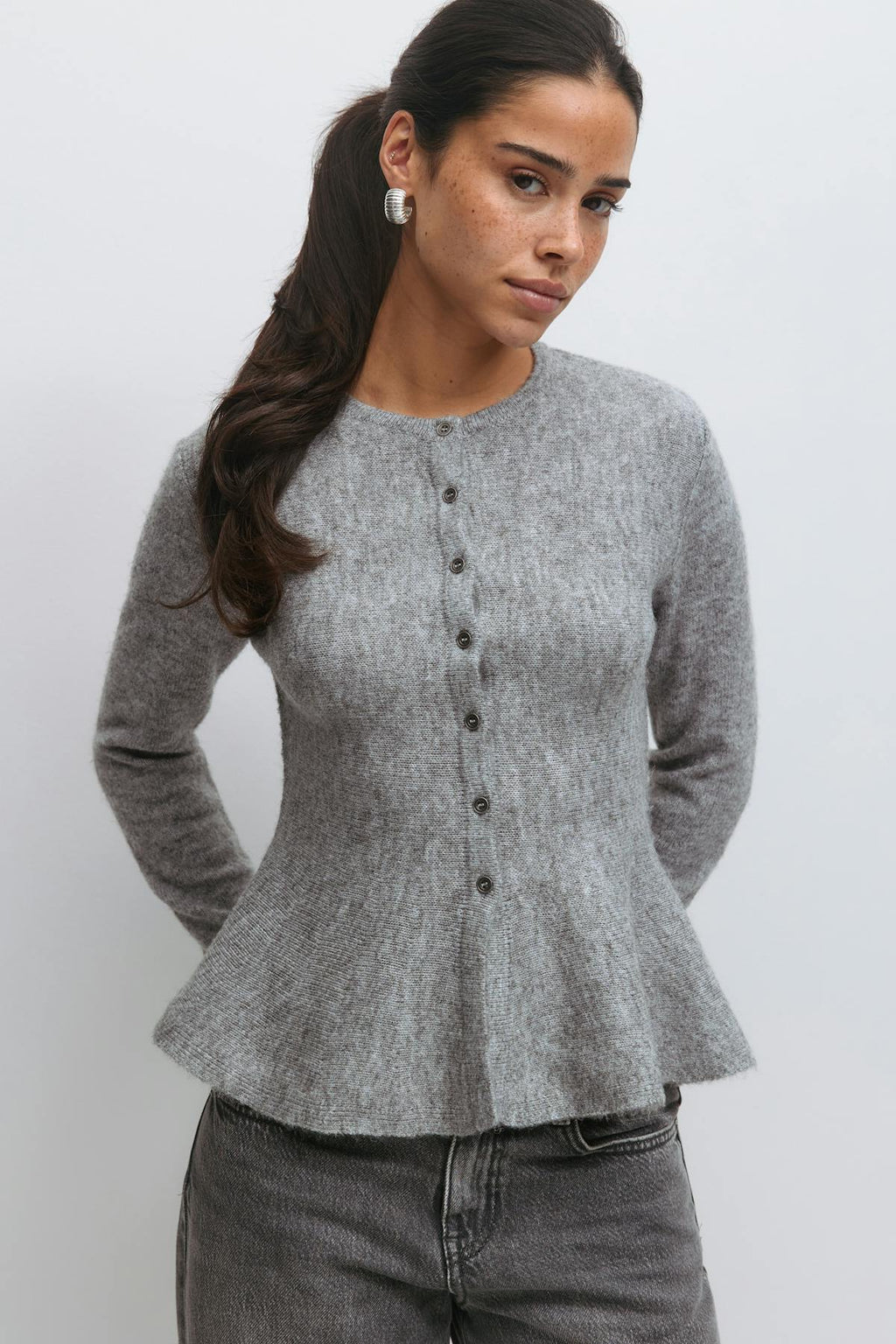 Knitted peplum cardigan