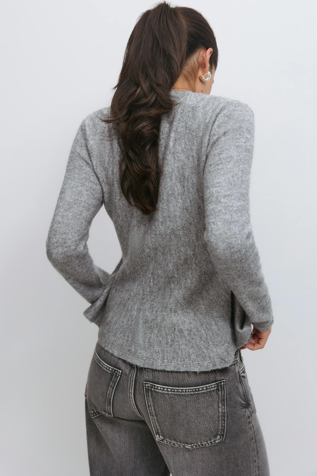 Knitted peplum cardigan
