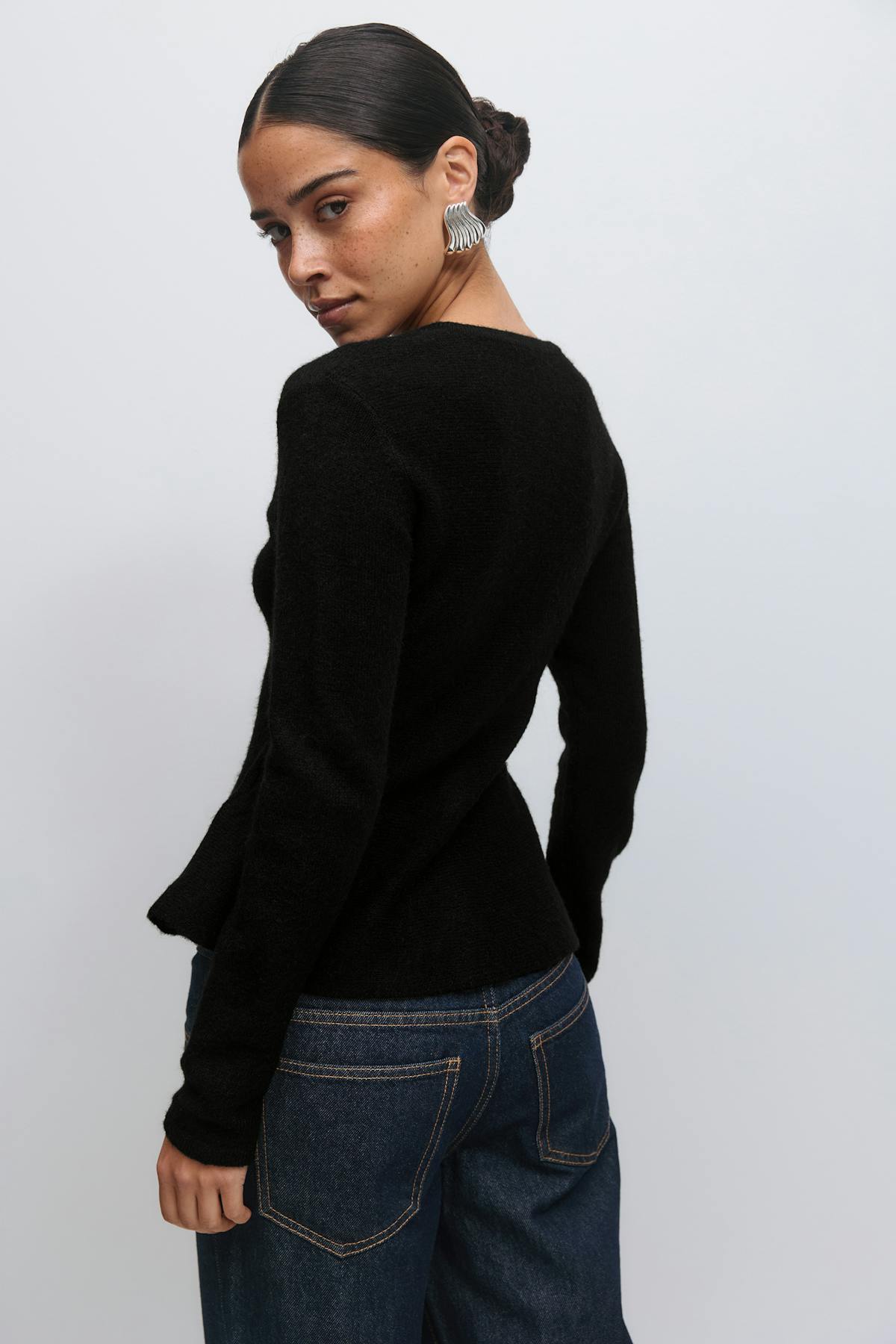 Knitted peplum cardigan