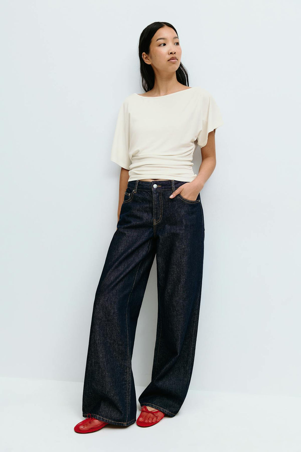 Sloped shoulder top