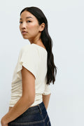 Sloped shoulder top