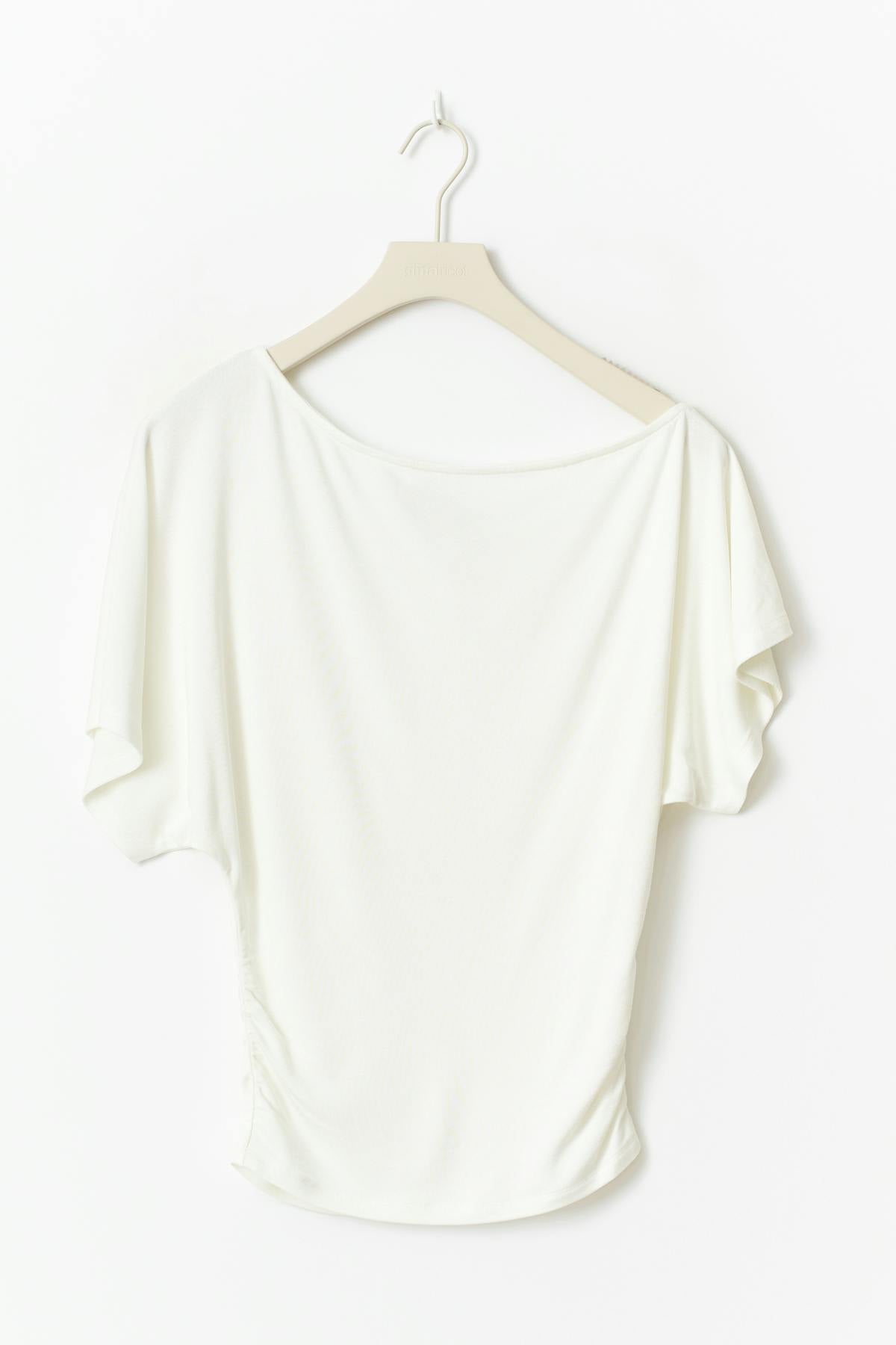 Sloped shoulder top