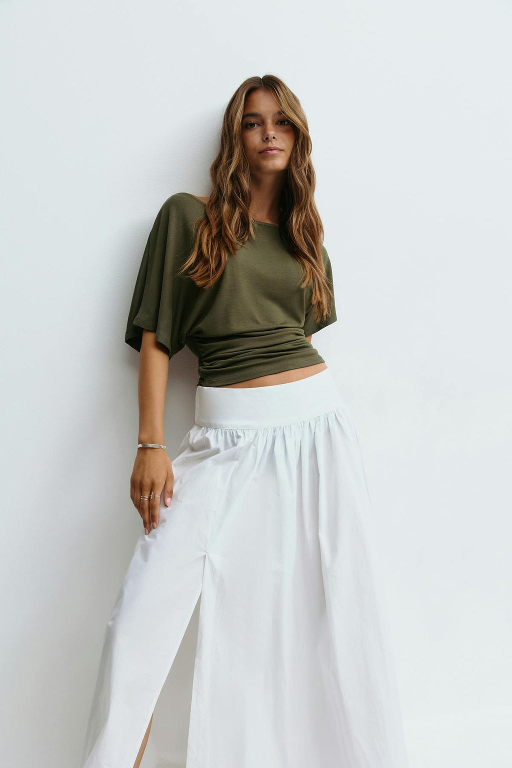 Sloped shoulder top