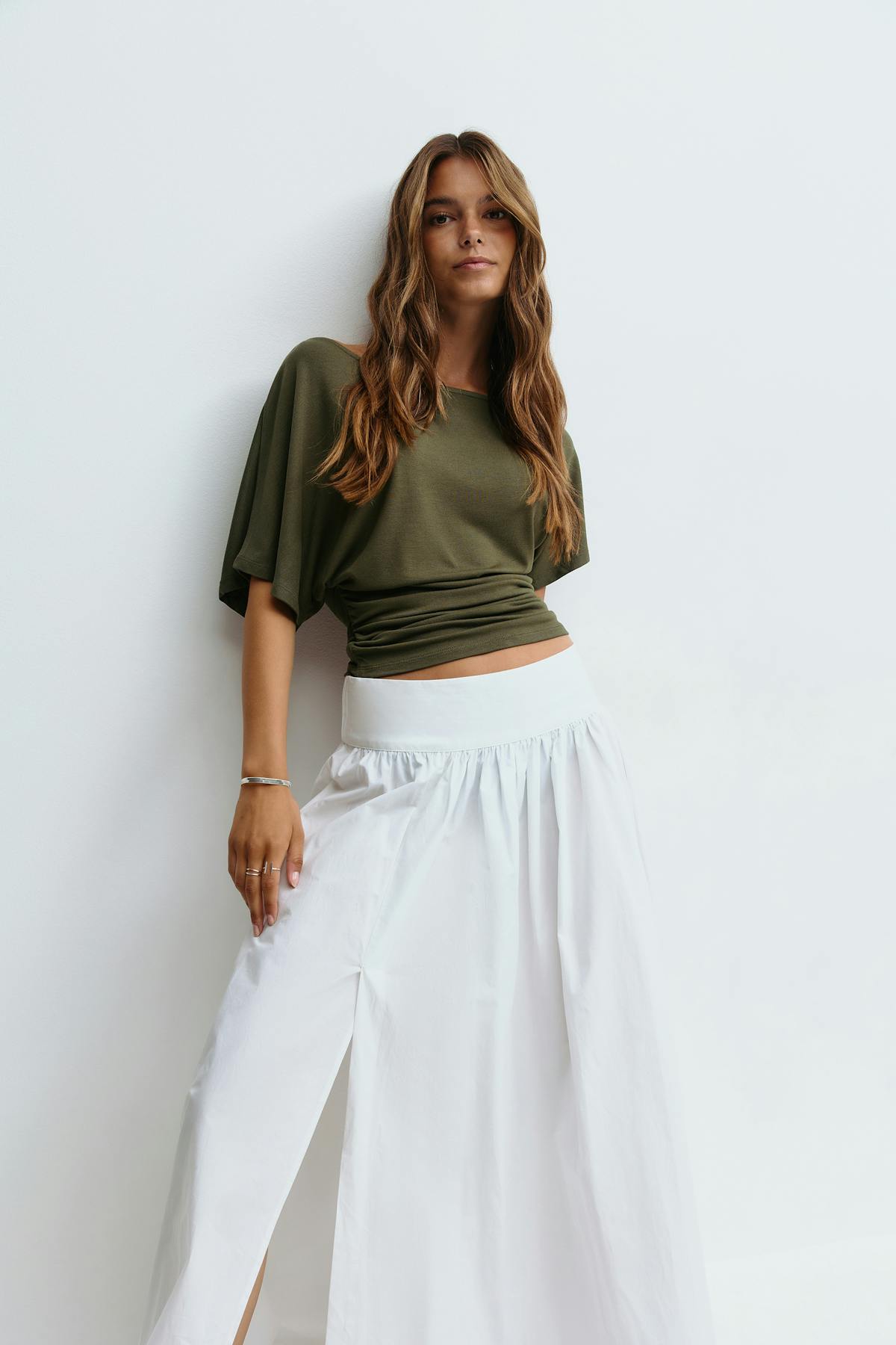 Sloped shoulder top
