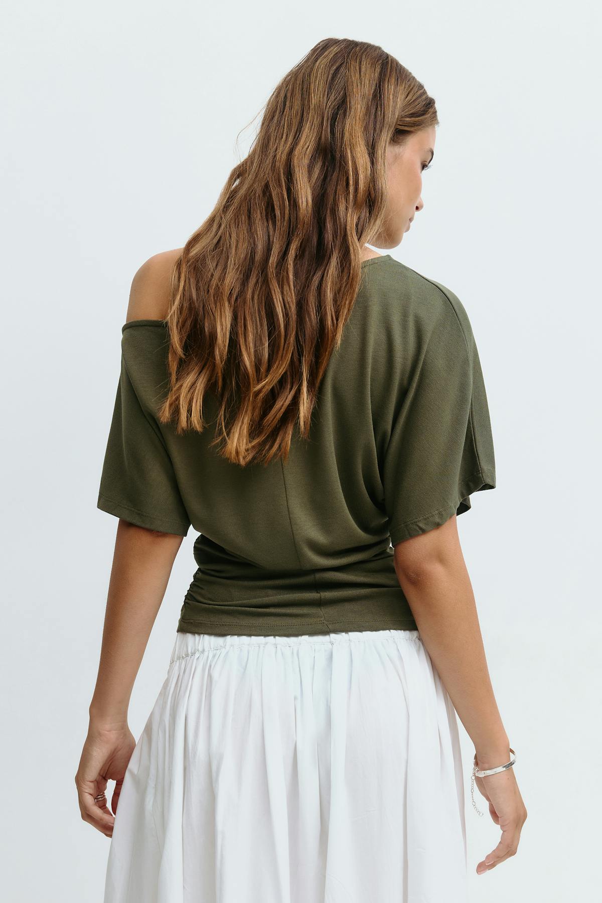 Sloped shoulder top