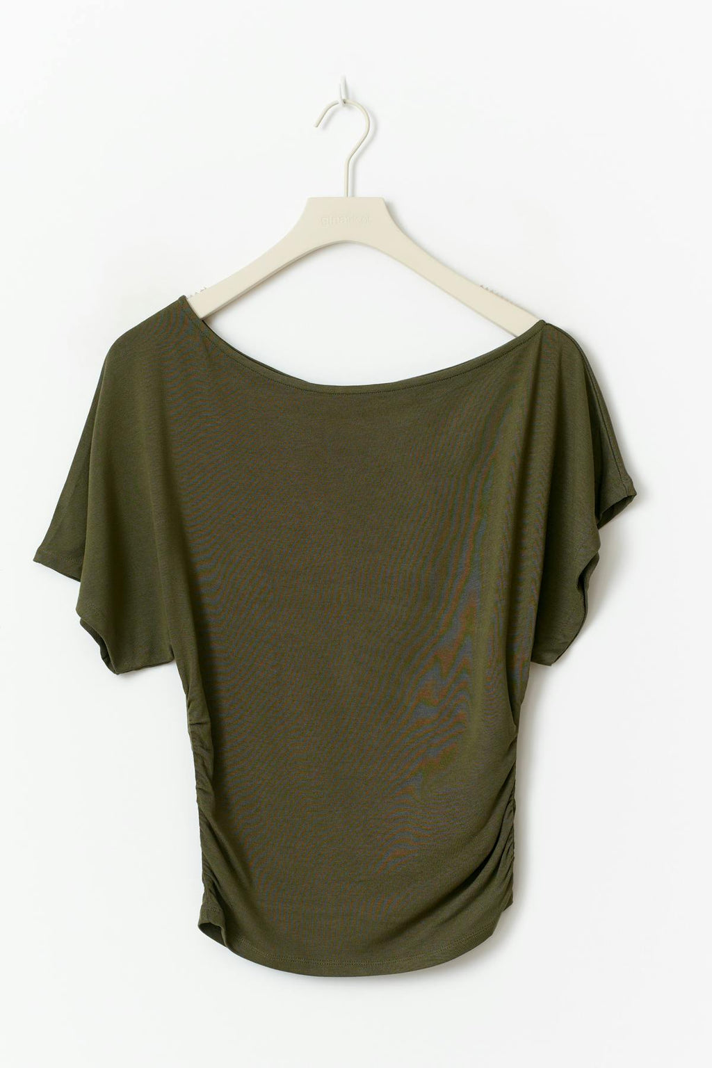Sloped shoulder top
