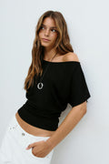Sloped shoulder top