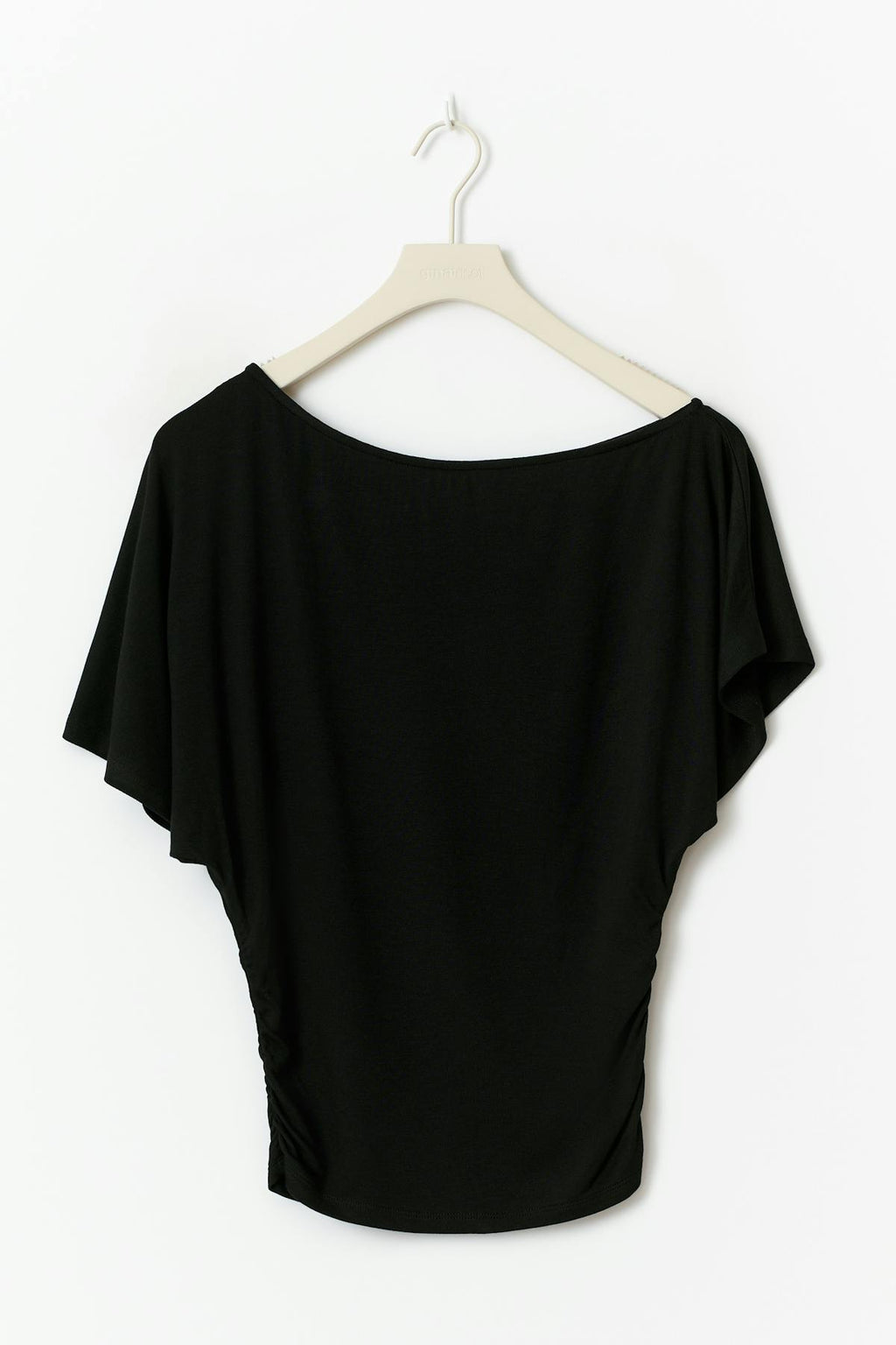 Sloped shoulder top