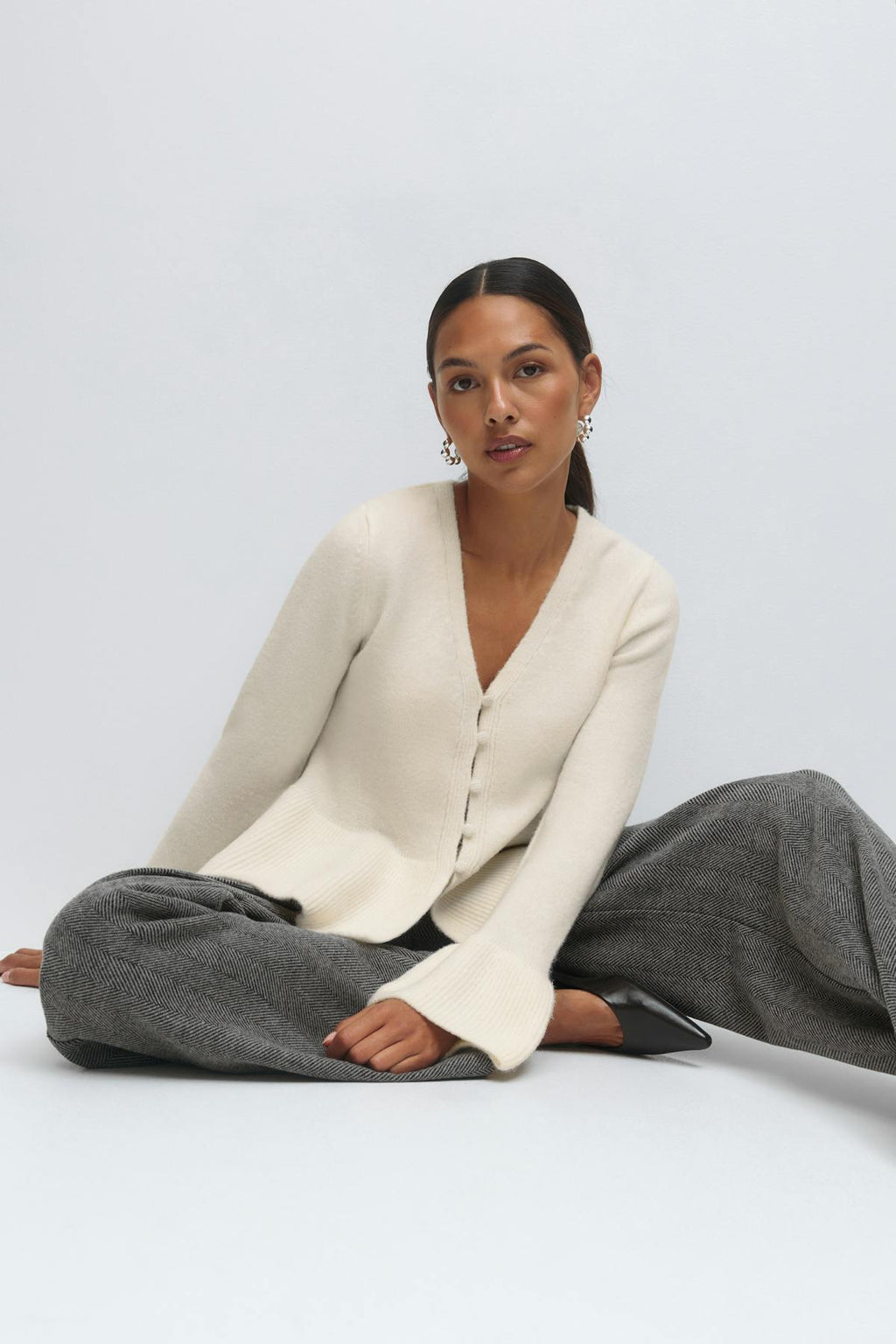 Knitted peplum cardigan