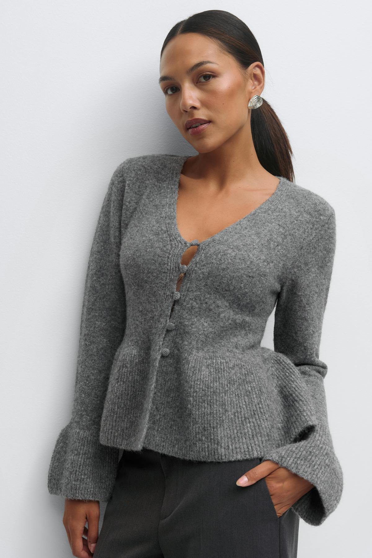 Knitted peplum cardigan