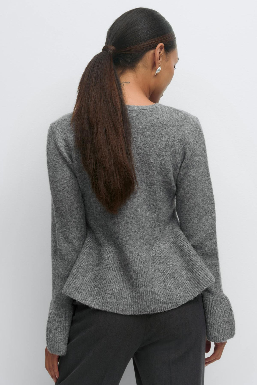 Knitted peplum cardigan