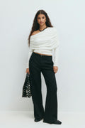 Sloped shoulder cape top