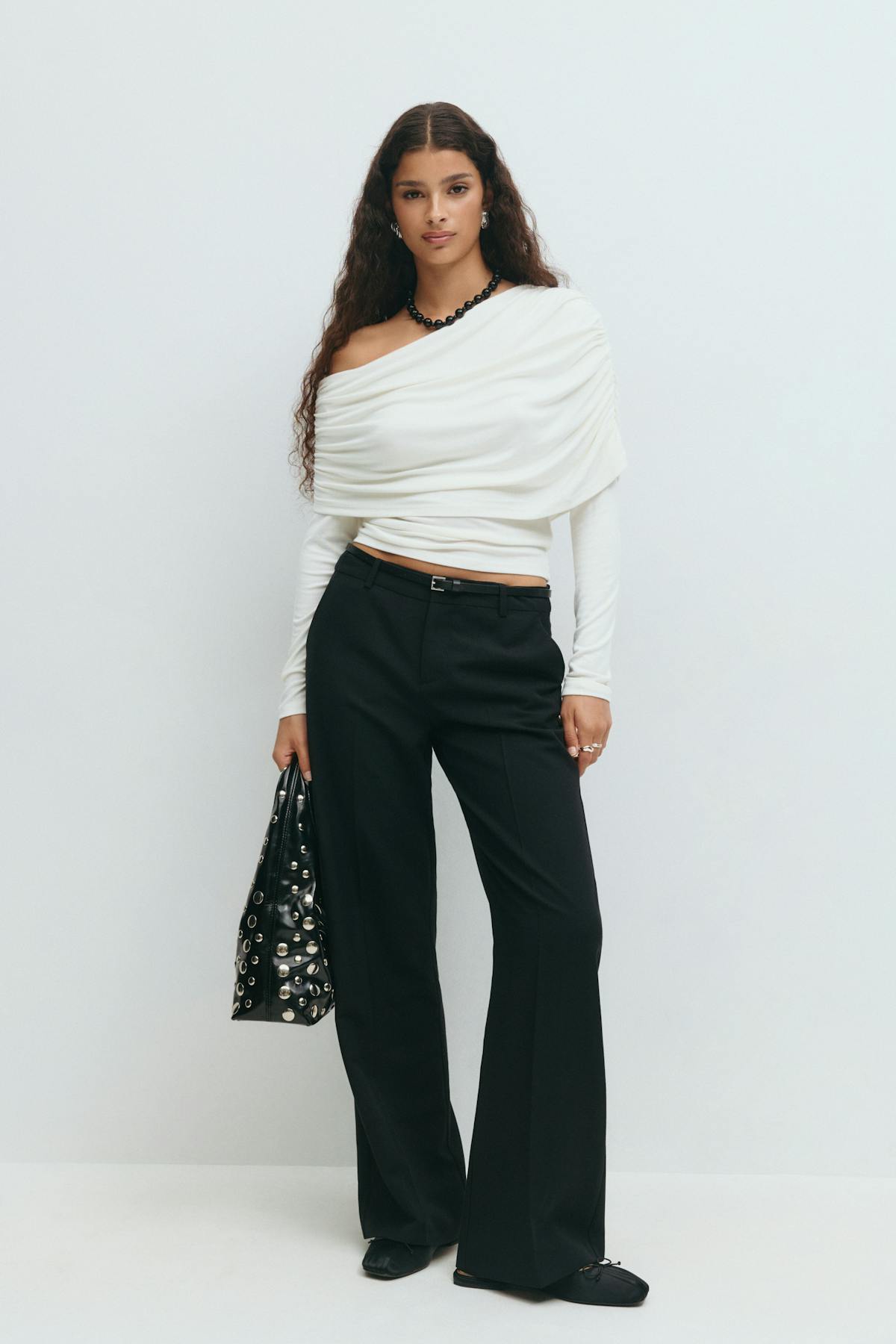 Sloped shoulder cape top