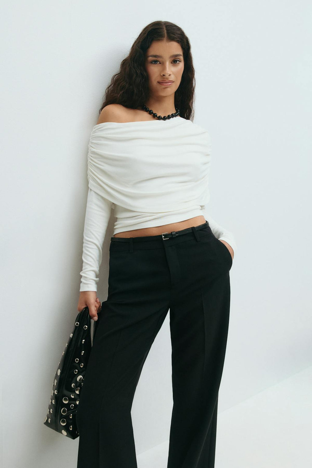 Sloped shoulder cape top