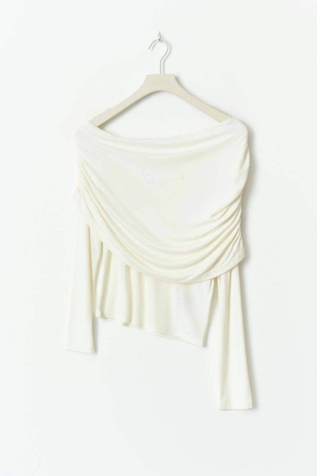 Sloped shoulder cape top