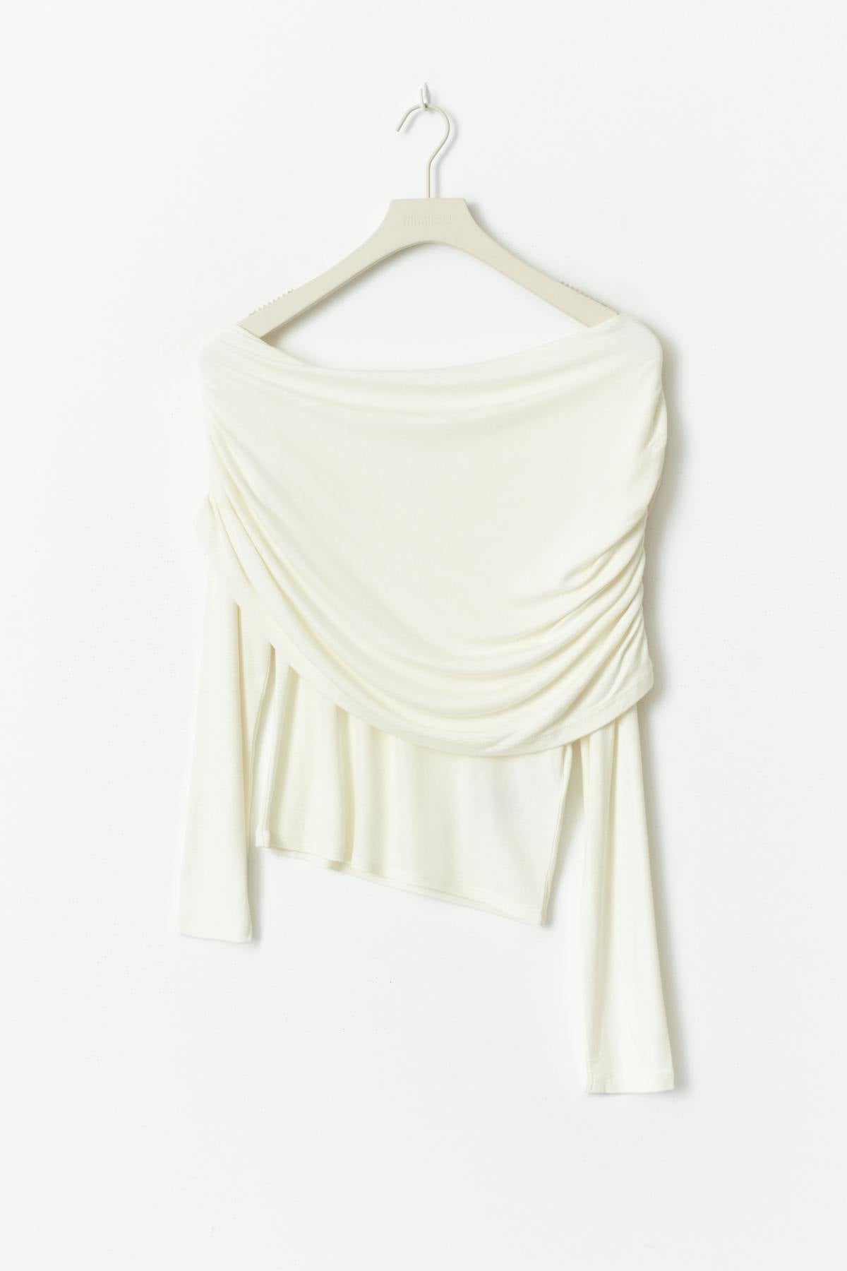 Sloped shoulder cape top