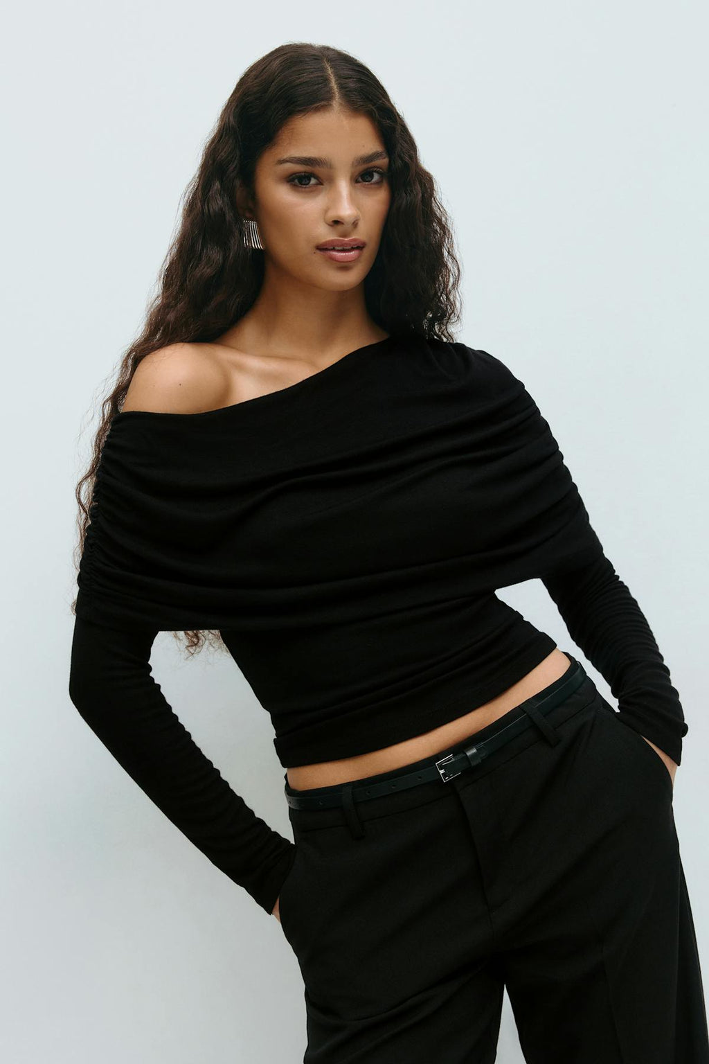 Sloped shoulder cape top