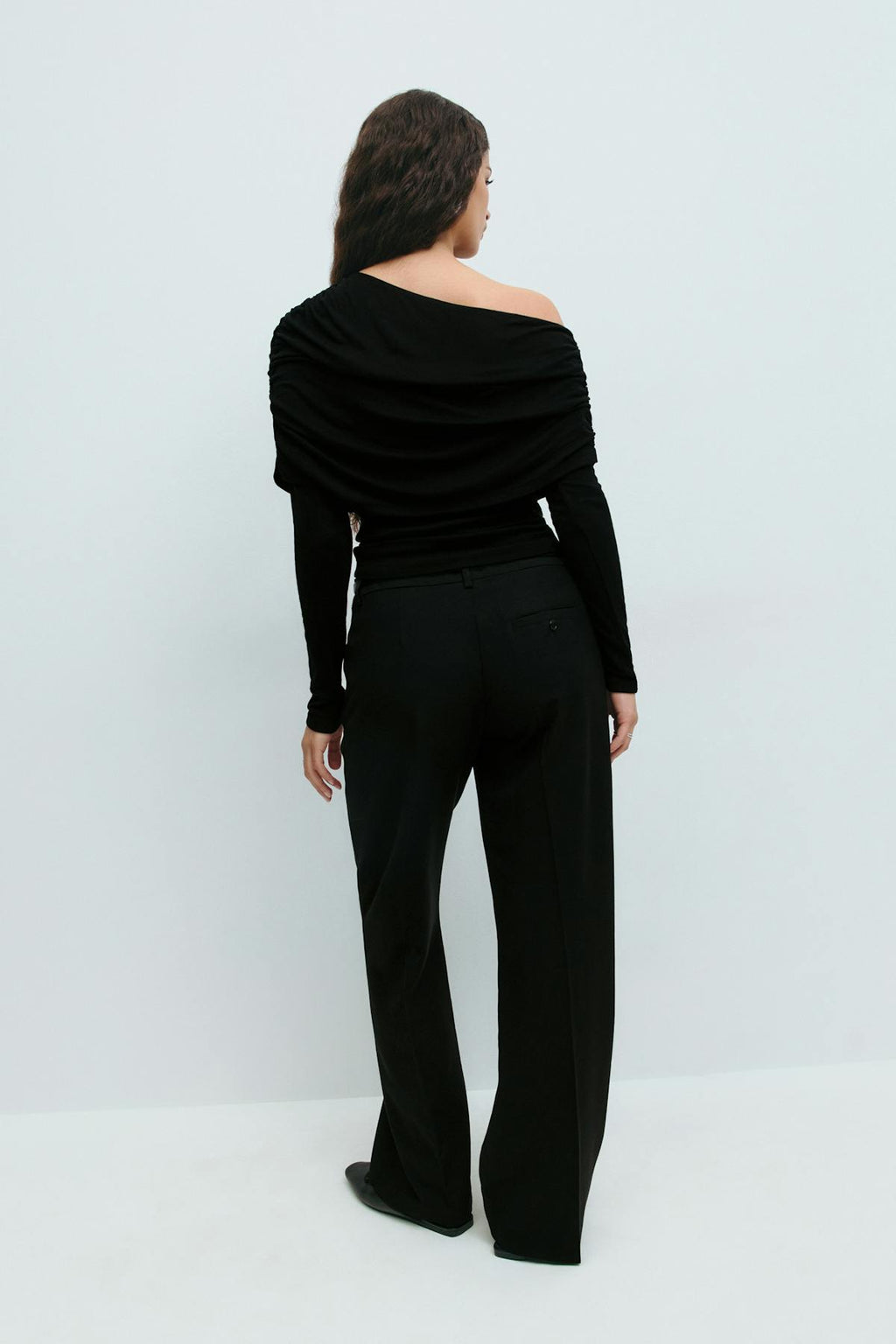 Sloped shoulder cape top