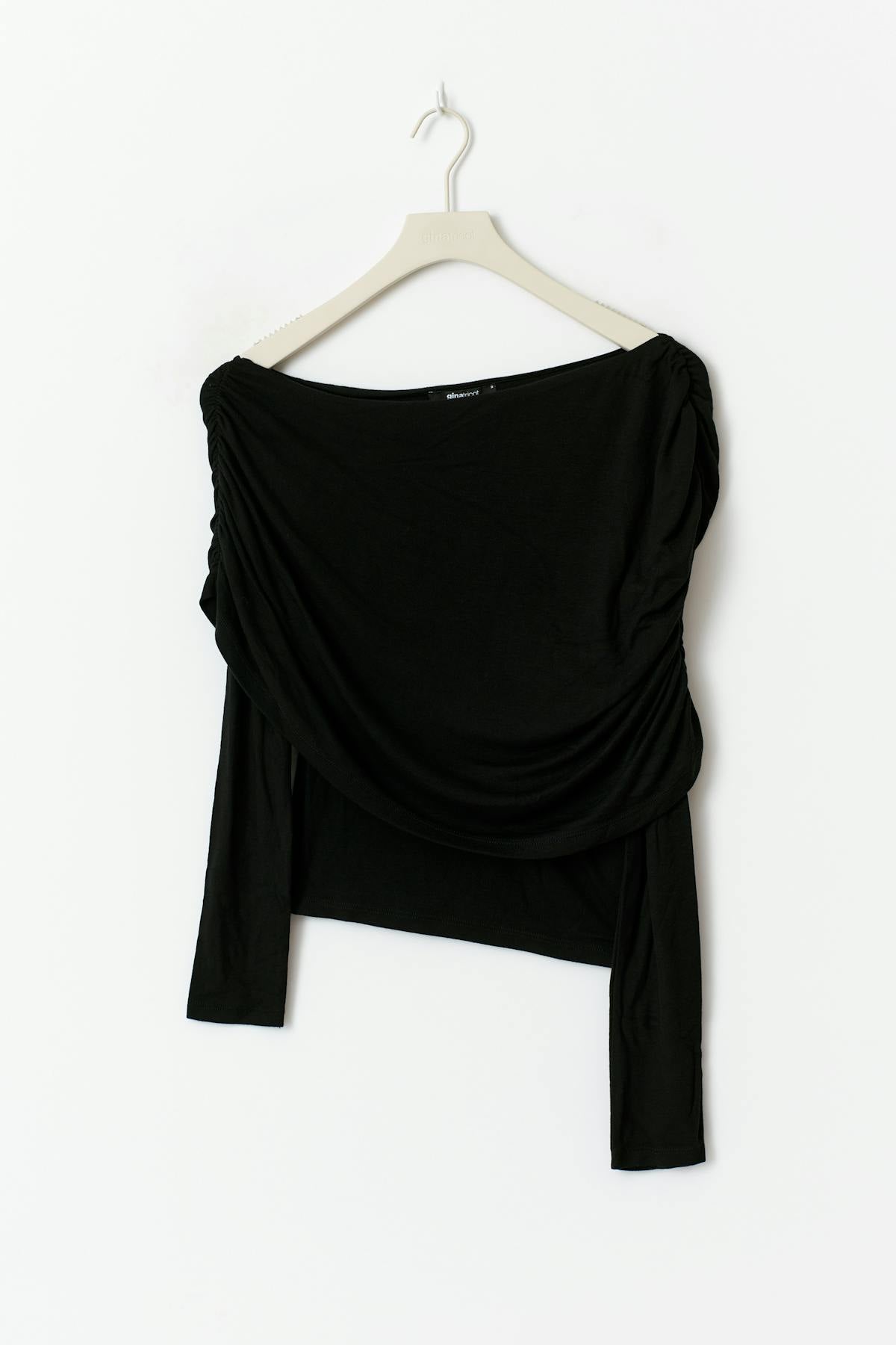 Sloped shoulder cape top