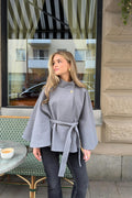 Y belted cape