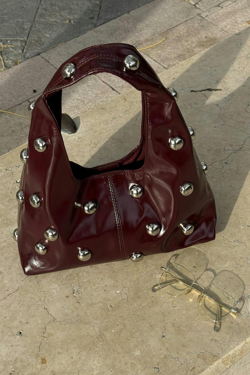 Slouchy studded bag
