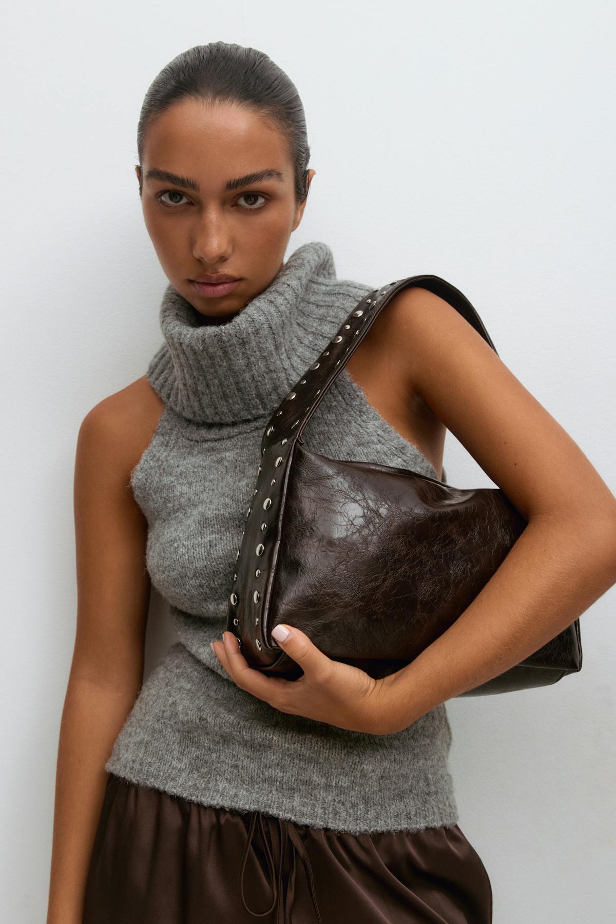 Small slouchy studded bag