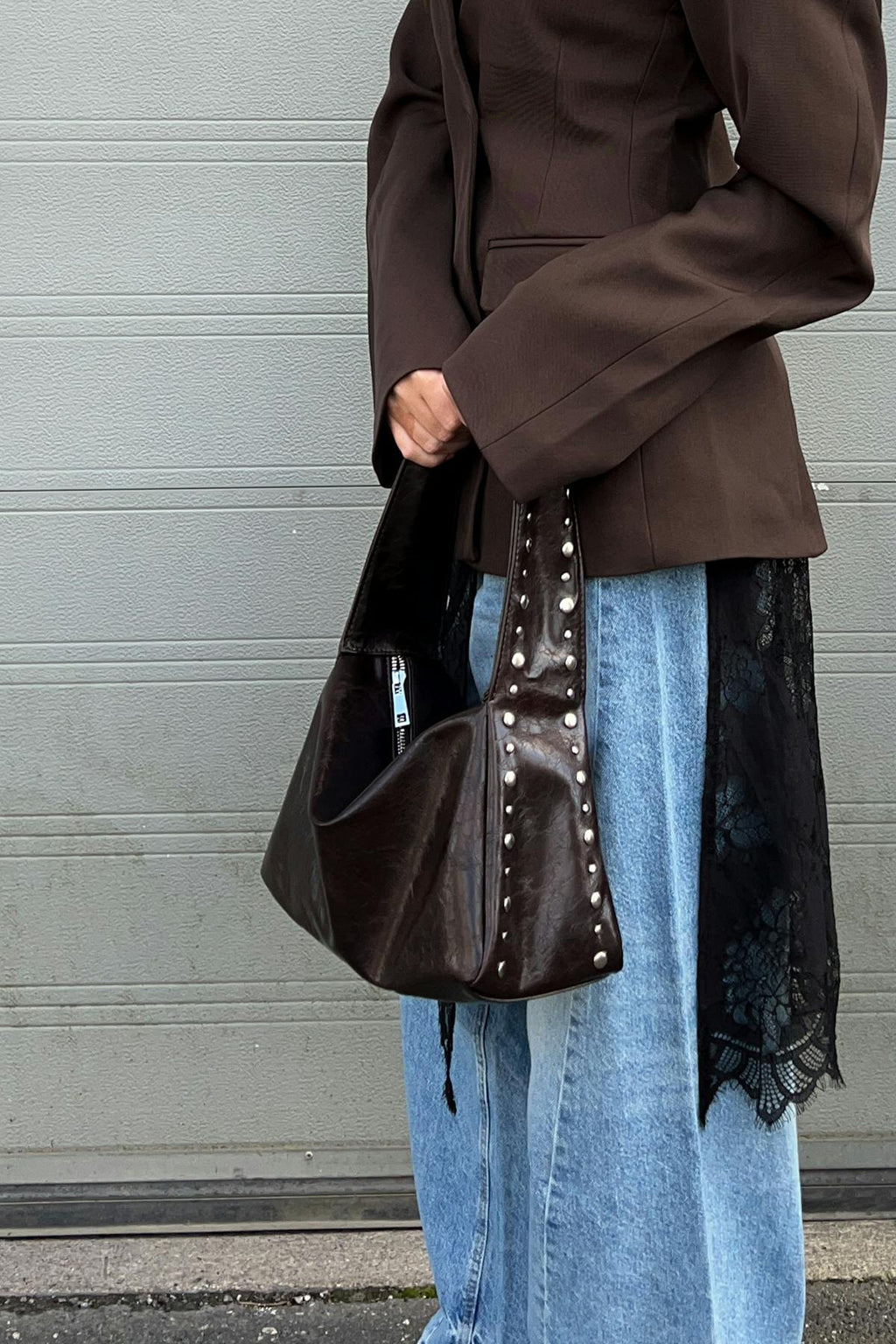 Small slouchy studded bag