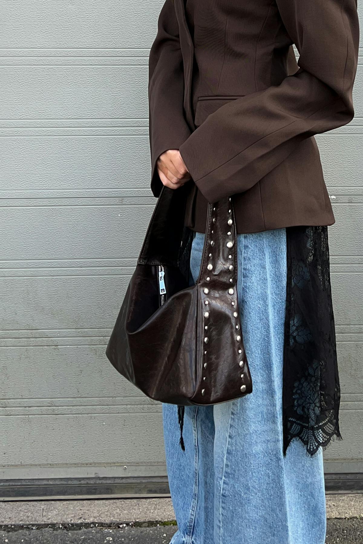Small slouchy studded bag